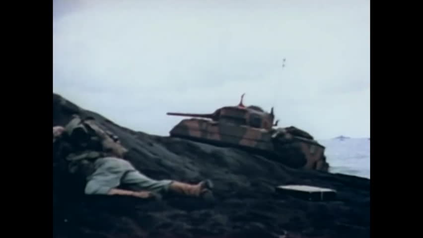 CIRCA 1945 - With the arrival of tanks, US Marines advance on Yellow Beach.