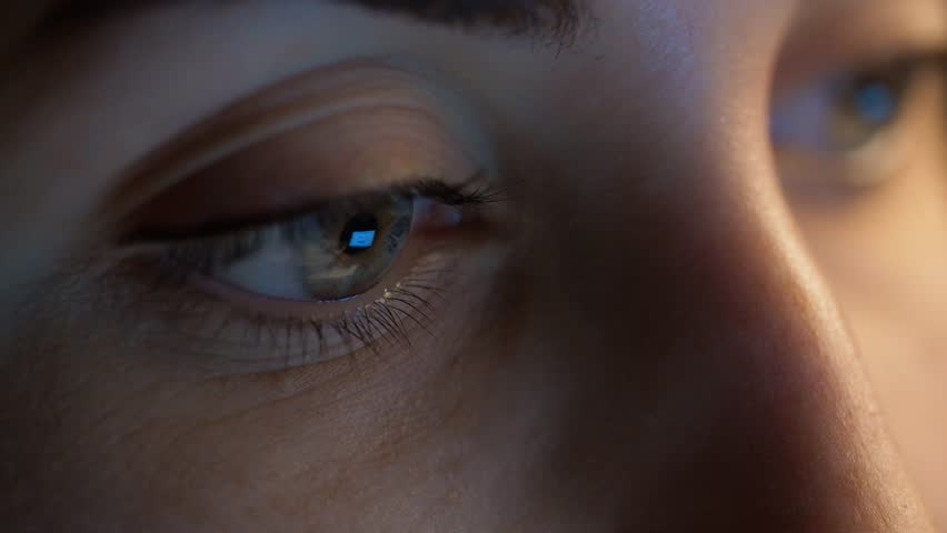 Vision and people concept - close up of woman eye looking at computer screen in darkness | Shutterstock HD Video #1006700059