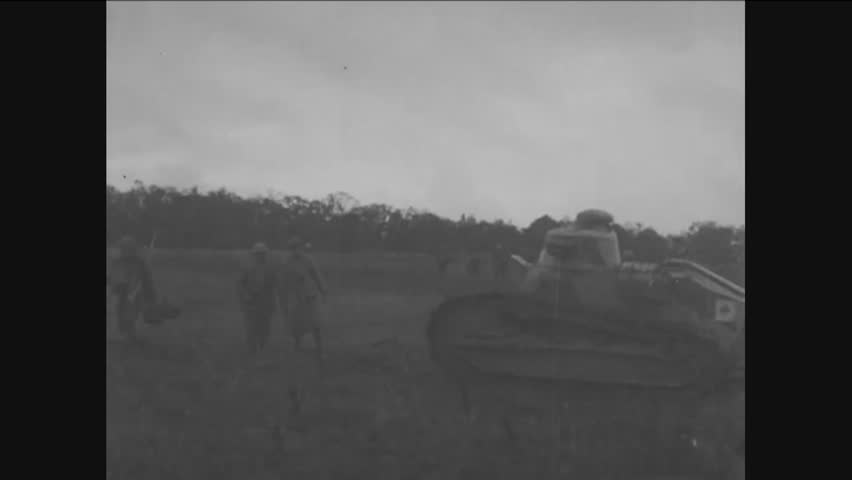 CIRCA 1918 - 167th infantrymen and tanks advance beneath artillery support at Seicheprey in France in World War 1.