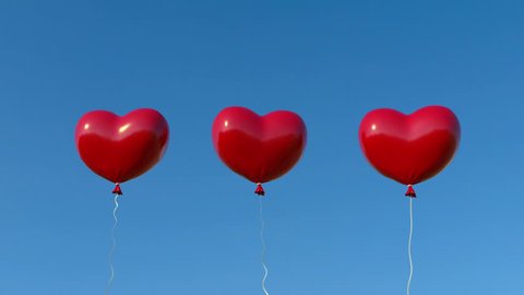 red hearts balloons over blue sky. Love, valentines day, romantic, wedding or birthday background.  Floating Red Heart.