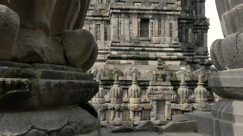 Beautiful ancient hindu temple Prambanan with traditional ornaments and carvings on monument walls. Traveling to Java Indonesia, Asia