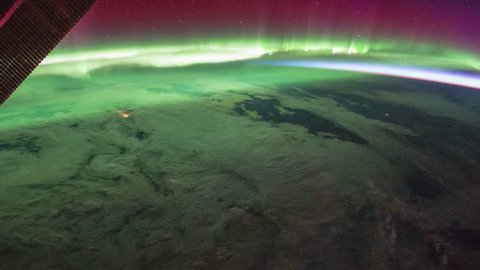 Beautiful and spectacular zoom out of time lapse Aurora Borealis over Canada from satellite at out space. Earth maps and images courtesy by Nasa.
