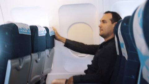 Male Passenger Feel Turbulence in Airplane