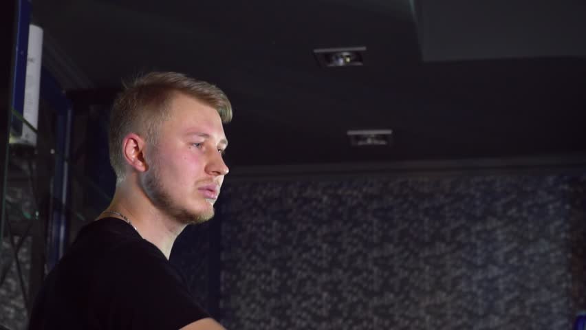 The bartender performs tricks with bottles and glasses Slow-mo