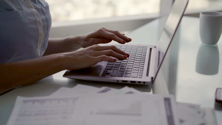 Businesswoman hands working on laptop by desk in the ffice, 4K
 | Shutterstock HD Video #1006732141