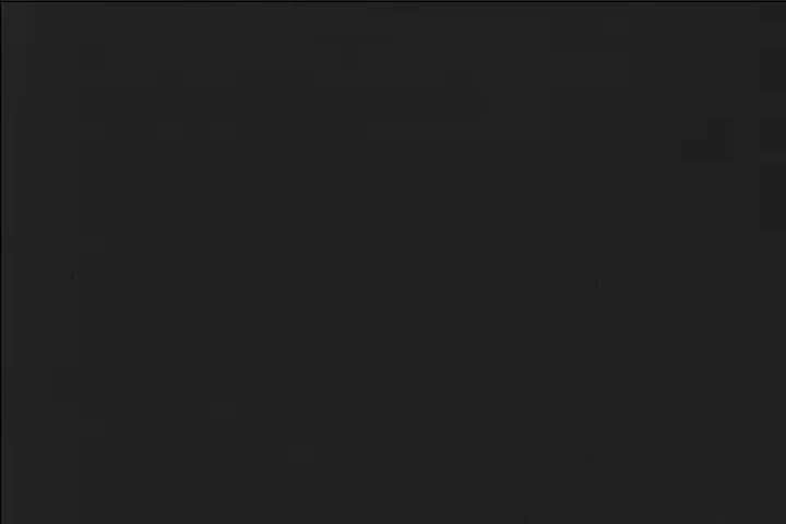 CIRCA 1951 Cargo and passengers are transported along canals in Venice.