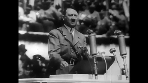 CIRCA 1940s - Adolf Hitler speaks at a Nazi rally and, later, defeated, paintings of him are burned and stomped in 1944.