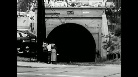 CIRCA 1950s - People waiting at a subway stop and examples of different modes of transport designed for in and around the cities in America in 1950.