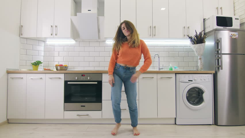 Young happy woman dancing in kitchen and having some fun, slow motion | Shutterstock HD Video #1006758112