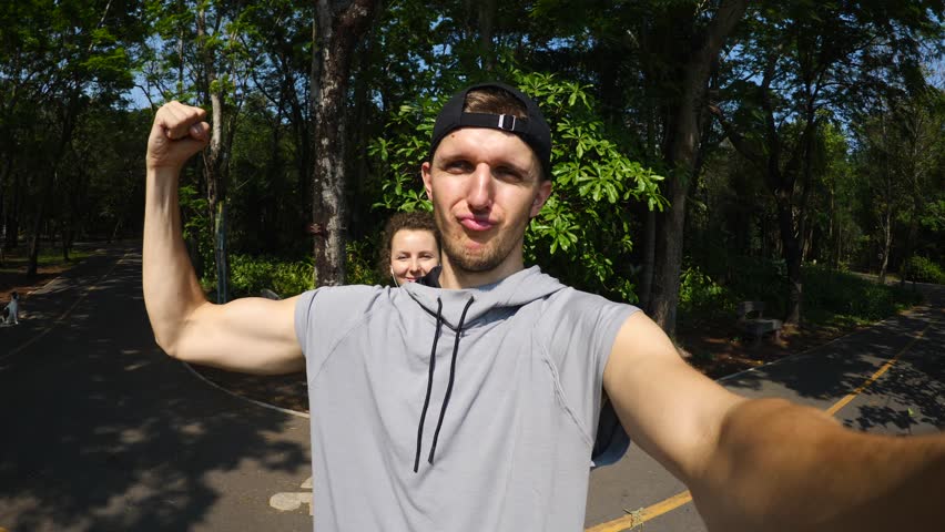 Young Sport Couple Taking Selfie Outdoors In Park After Running