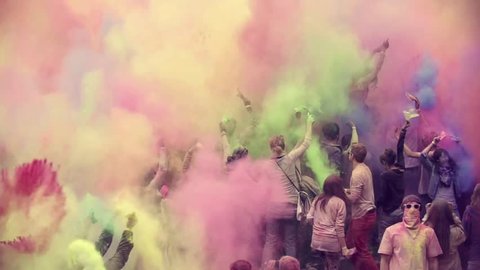 hamburg - germany, octobers 2016. multi ethnic group of teens celebrating holi festival color, shot in epic slow motion