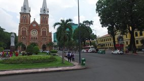 HO CHI MINH CITY, VIETNAM – MAY, 2016 : Video shot of Saigon Cathedral / Notre Dame on a sunny day with traffic in view