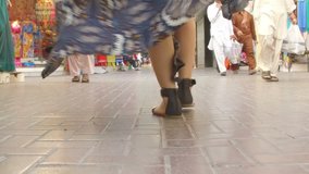 DUBAI, UAE – MARCH 2016 : Slow motion video of beautful woman walking at Deira Market on a sunny day