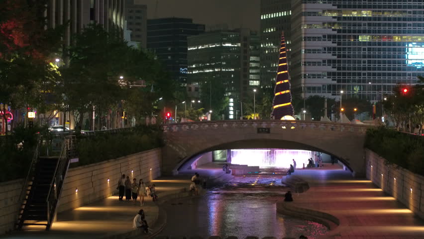 SEOUL, SOUTH KOREA – JULY 216 : Video shot of Cheonggyecheon / Seoul Canal at night with stream and people in view
