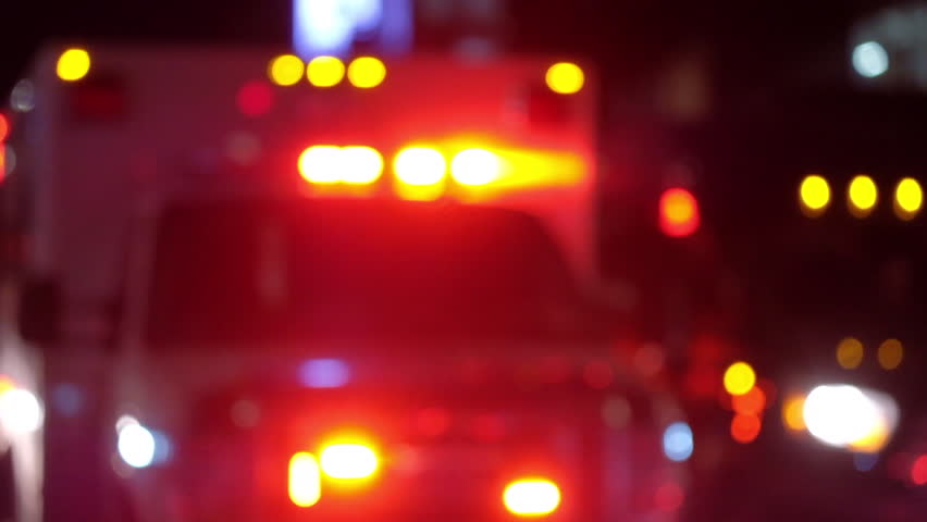 Blurred shot of ambulance with emergency lights flashing Royalty-Free Stock Footage #1006797280