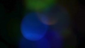 Abstract blurred transparency big bokeh movie, glowing magical lights. Background for tv show, intro, opener, christmas theme, holiday, party, clubs, event, music clips, advertising footage. 