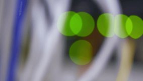 Green bokeh LED lights blinking on back side of working data server - Powered by Shutterstock - Get 15% off with code: PIKWIZARD15