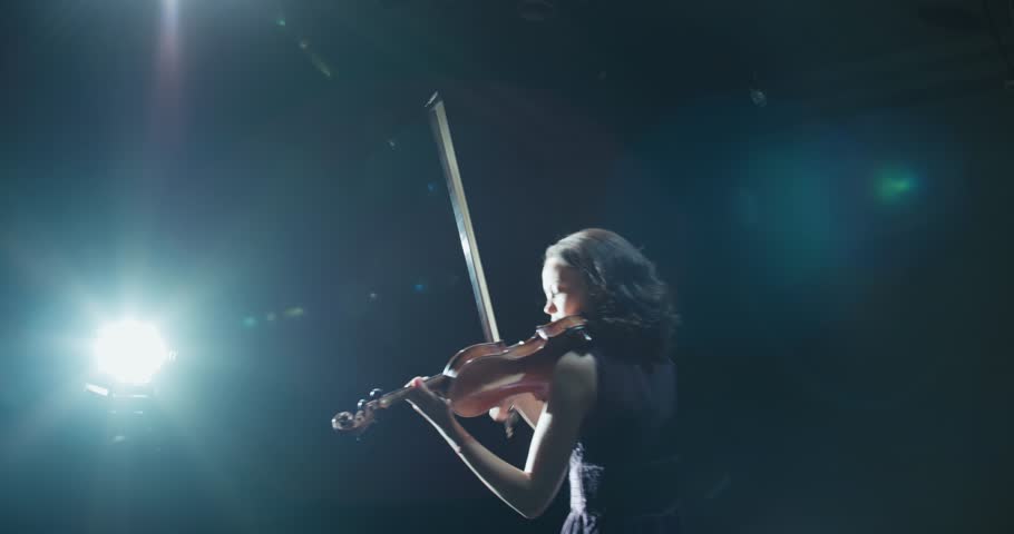 beautiful young girl playing the violin during the concert Royalty-Free Stock Footage #1006810411
