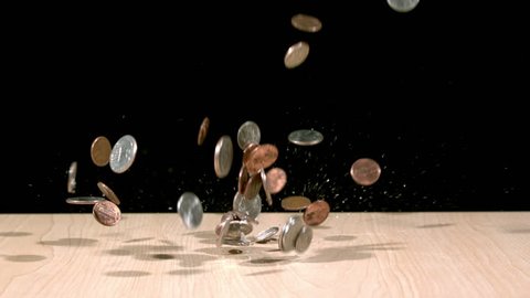 coins splashing onto table