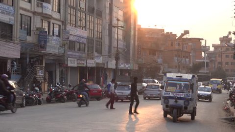 KATHMANDU, NEPAL - JAN 21: Traffic and pedestrians in the inner city at sunset on January 21, 2018 in Kathmandu, Nepal 