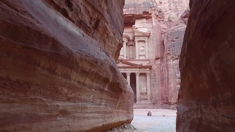 Petra - ancient city, view of Treasury from As Siq gorge  with camels in front of facade. Jordan.