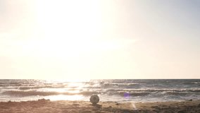Young man in swimming trunks exulting with german flag on the sea shore at the beach at sunset silhouette - Powered by Shutterstock - Get 15% off with code: PIKWIZARD15