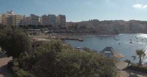 MALTA – AUGUST 2016 : Video shot on Sliema beach on a beautiful day with harbor and cityscape in view