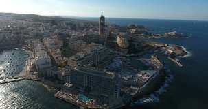 MALTA – AUGUST 2016 : Aerial shot of Sliema beach on a sunny day with hotels and boats in view