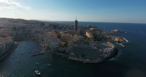 MALTA – AUGUST 2016 : Aerial shot of Sliema cityscape on a sunny day with harbor and boats in view