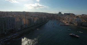 MALTA – AUGUST 2016 : Aerial shot of Sliema cityscape on a sunny day with harbor and boats in view