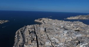 MALTA – AUGUST 2016 : Aerial shot of Valletta cityscape on a beauiful day with city walls and sea in view