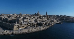 MALTA – AUGUST 2016 : Aerial shot of Valletta cityscape on a beauiful day with city walls and Carmelite church in view
