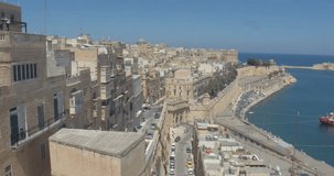 MALTA – AUGUST 2016 : Video shot from Valletta city wall on a sunny day harbor and ships in view