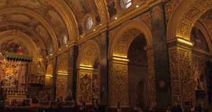 MALTA – AUGUST 2016 : Video shot inside Valletta Church with beautiful interior and people in view
