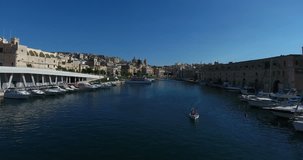 MALTA – AUGUST 2016 : Aerial shot over Valletta harbor on a sunny day with cityscape in view