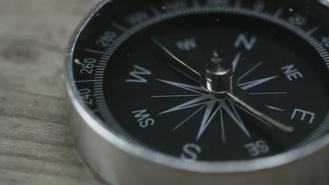 Close up shot of a spinning vintage compass