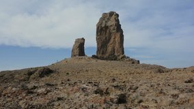 Roque Nublo mountain in Canary Islands with blue sky. Cinematic camera movement. Nature concept video.