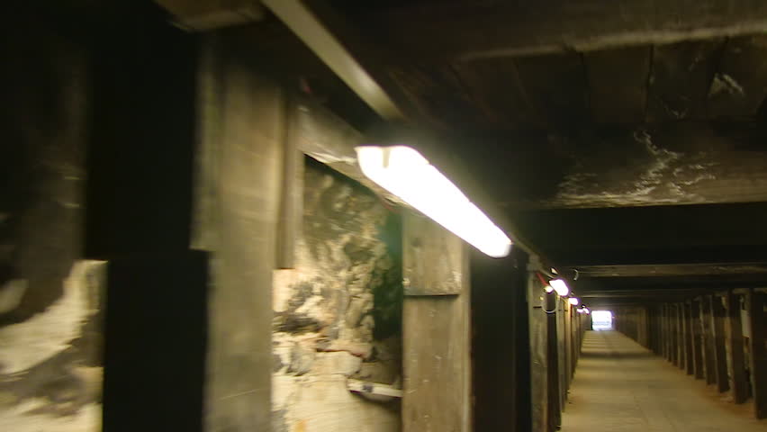 A moving shot of a tunnel with lights.