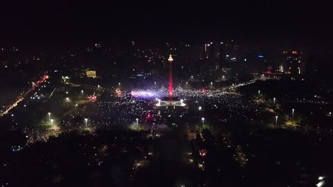 Beautiful aerial view of 2018 New Year eve party in National Monument with sparkle fireworks, Central Jakarta, Indonesia