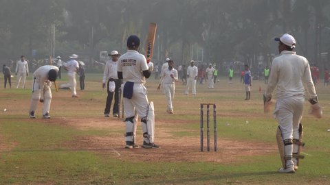 MUMBAI, INDIA - NOV 15: People playing cricket match in traditional whites on November 15, 2017 in Mumbai, India 