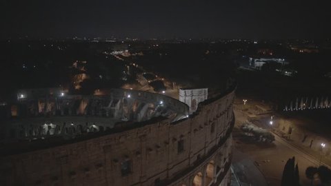 Aerial Drone footage view of Colosseum in Rome Italy by night // no video editing