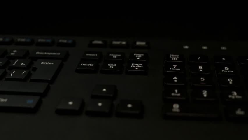 US dollars and bank card on the keyboard.