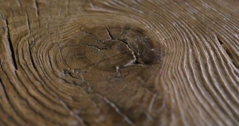 Macro shot of a precious wood in which you can see the color, the wood grain, the knots and the high quality workmanship. Concept of: love for nature, wood, furniture.