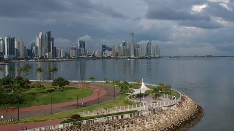 Drone fly towards Panama City Skyline over water