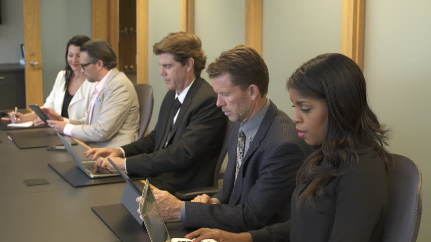 Medium shot of business people typing on a meeting Royalty-Free Stock Footage #1006902034