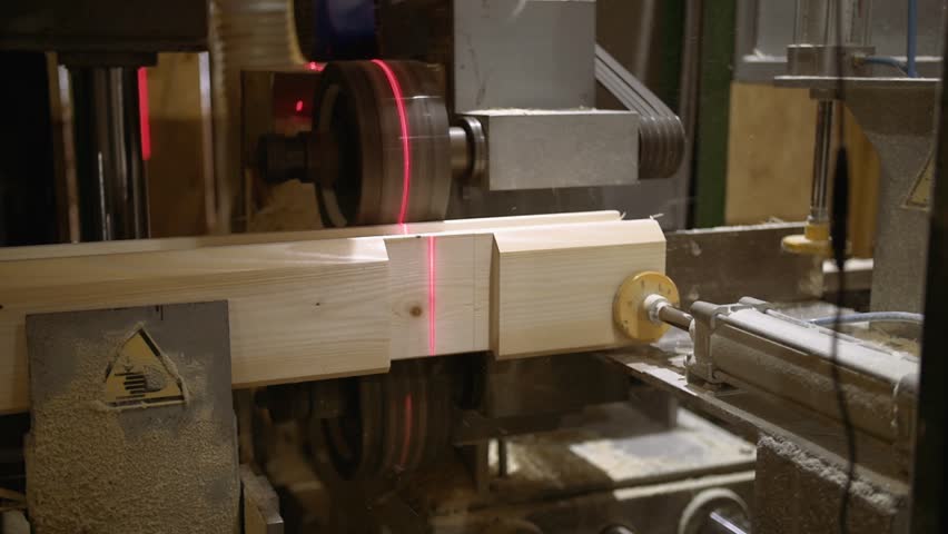 Woodwork machine with laser pointer makes precise chute on wooden block at sawmill facility, lots of sawdust, close up | Shutterstock HD Video #1006913443