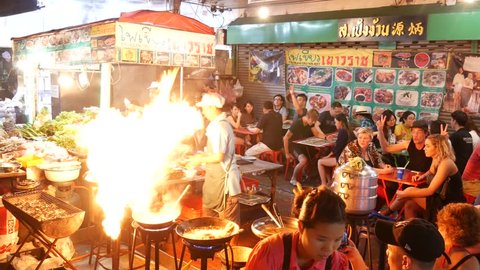 Bangkok, Thailand-January 27, 2018: People dining and bustling around China town of Bangkok. Yaowarat Road (China Town) is famous for street food with lively environment.. 