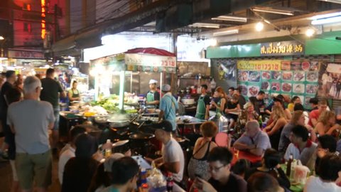 Bangkok, Thailand-January 27, 2018: People dining and bustling around China town of Bangkok. Yaowarat Road (China Town) is famous for street food with lively environment. 