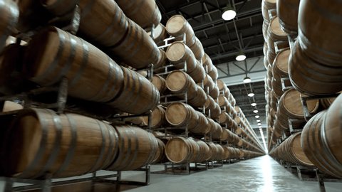 Whiskey or wine barrels stacked in rows at the warehouse