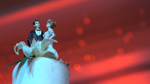 couple dolls on the wedding cake in beautiful background – Stockvideo